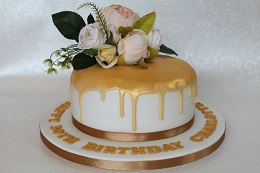 gold flower drip cake